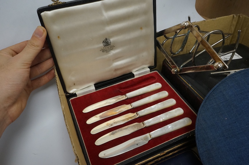 Assorted silver and plated wares including a Danish white metal mounted cigarette box, 10.2cm, six cased sets including six silver coffee spoons, five mother of pearl handled silver butter knives, six silver pistol handl